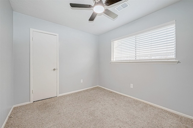 carpeted empty room with ceiling fan