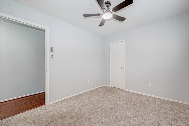 spare room with carpet flooring and ceiling fan