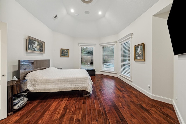 bedroom with dark hardwood / wood-style flooring