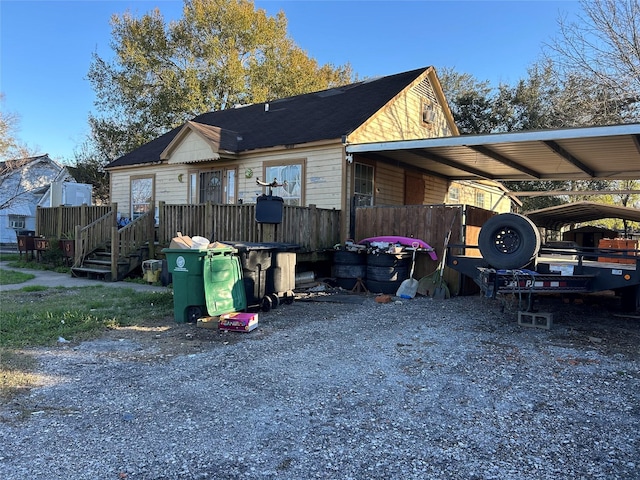 exterior space with a carport