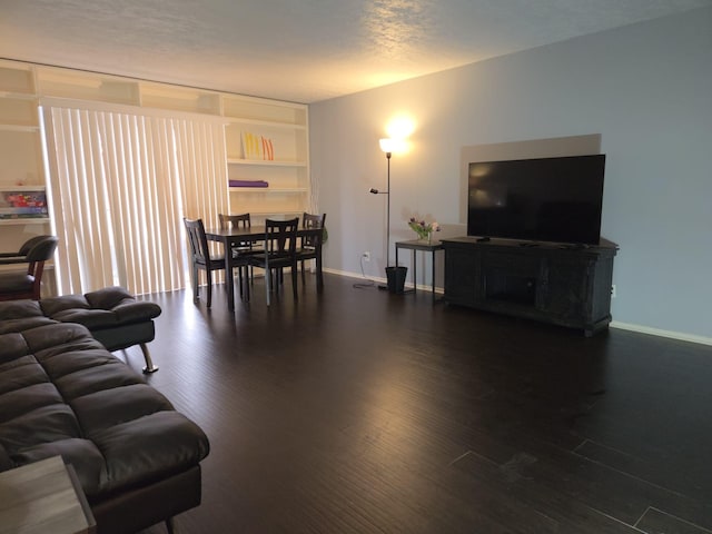 living room featuring dark hardwood / wood-style floors