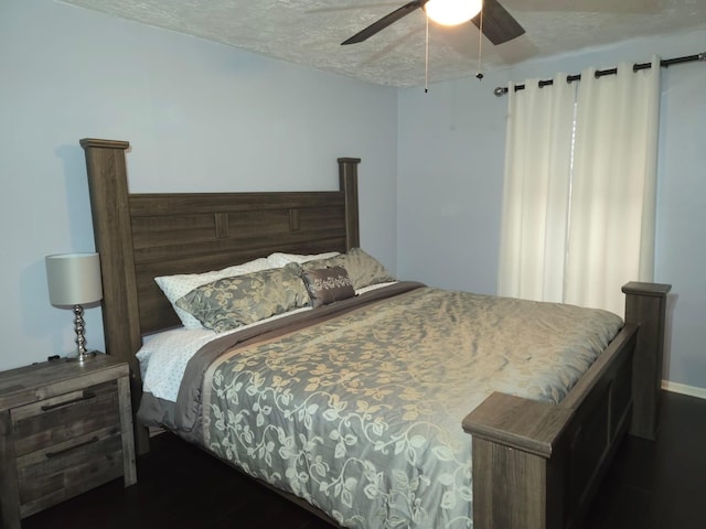 bedroom with a textured ceiling and ceiling fan