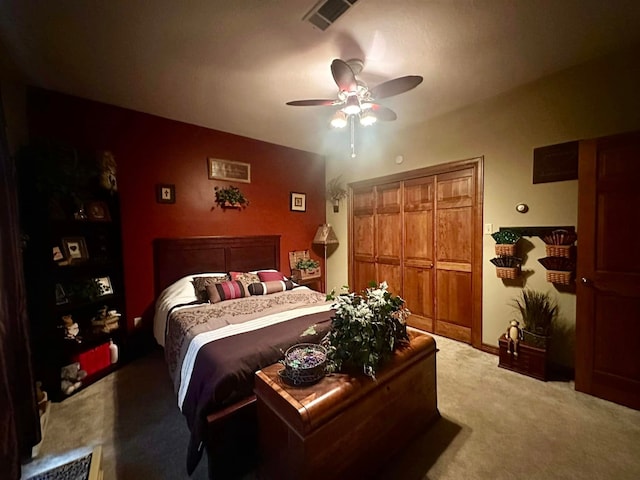 bedroom with ceiling fan, a closet, and carpet