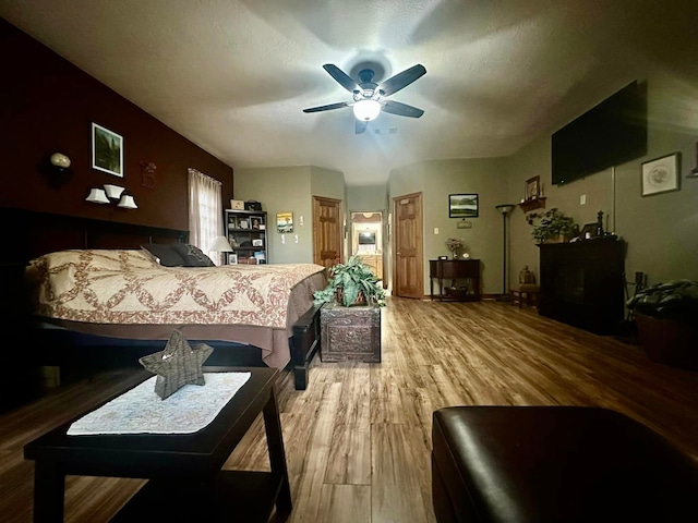 bedroom featuring ceiling fan and hardwood / wood-style floors