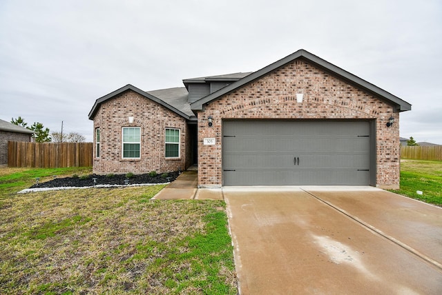 view of front facade featuring a garage and a front yard