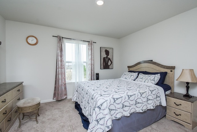 bedroom with light carpet