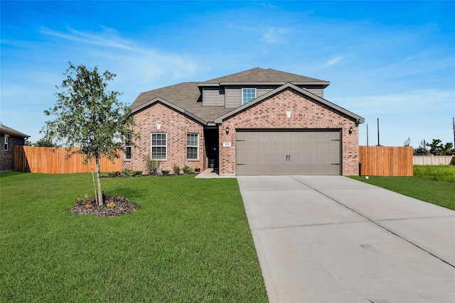 view of front property featuring a front lawn and a garage