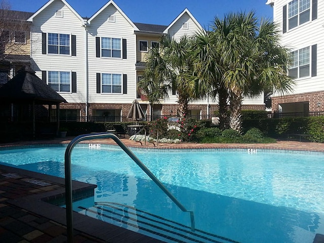 community pool featuring fence