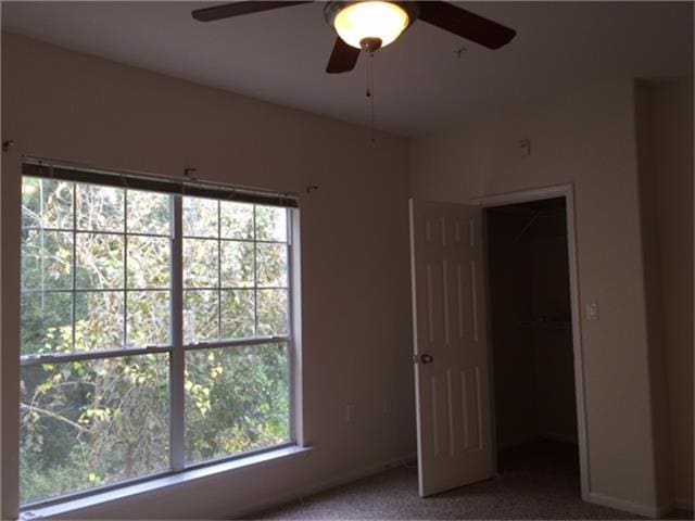 unfurnished bedroom with carpet floors and ceiling fan