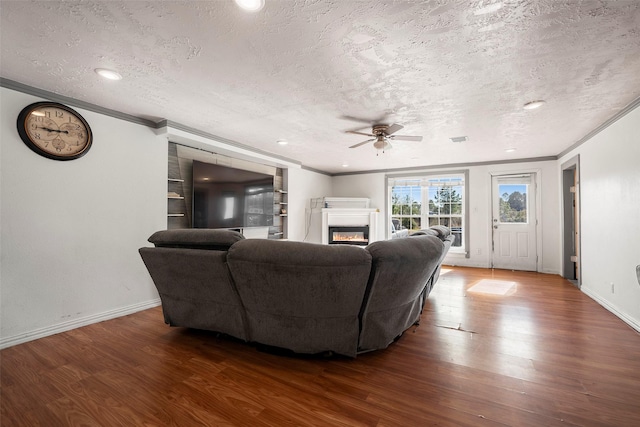 living room featuring a textured ceiling, ceiling fan, and dark hardwood / wood-style flooring