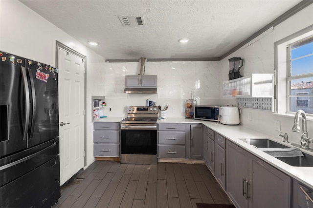 kitchen featuring black appliances, sink, gray cabinetry, and a textured ceiling