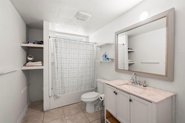 full bathroom with toilet, shower / bath combo with shower curtain, tile patterned floors, a textured ceiling, and vanity