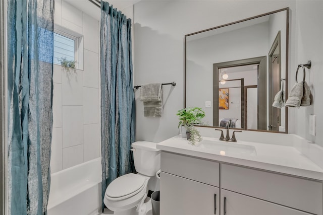 full bathroom featuring toilet, shower / bath combo, and vanity