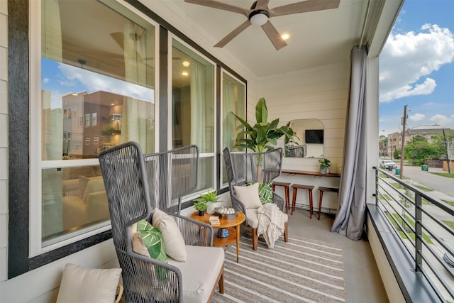 balcony featuring ceiling fan