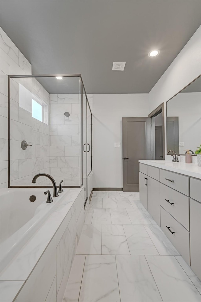 bathroom featuring vanity and separate shower and tub