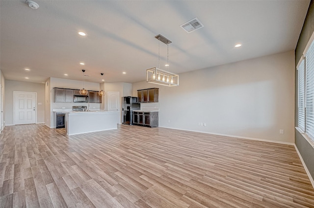 unfurnished living room with light hardwood / wood-style floors