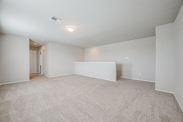 unfurnished room with light colored carpet