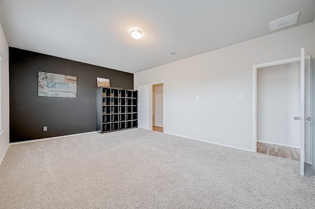 unfurnished bedroom with carpet