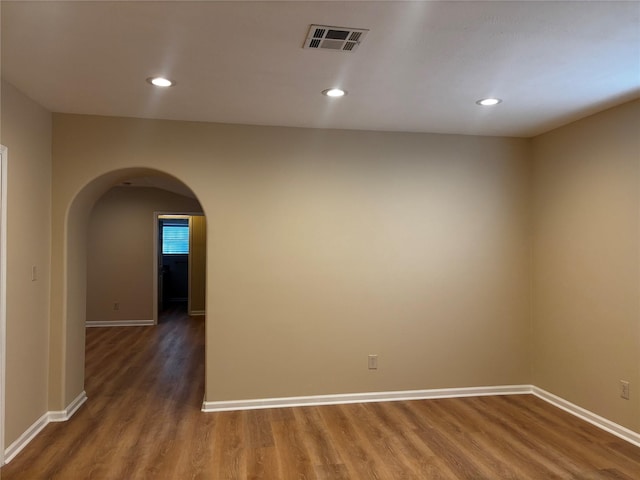 spare room with dark hardwood / wood-style floors