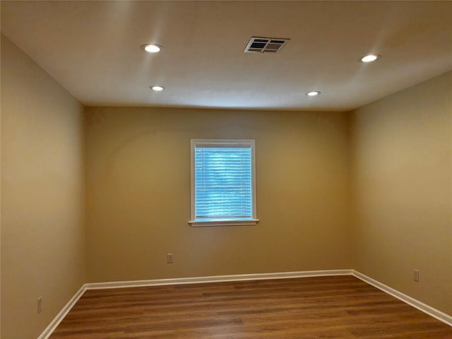 unfurnished room featuring hardwood / wood-style flooring