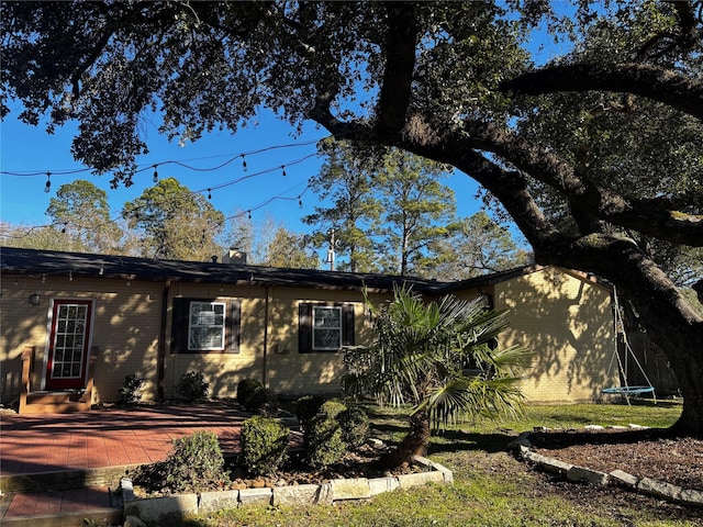 view of property exterior featuring a trampoline