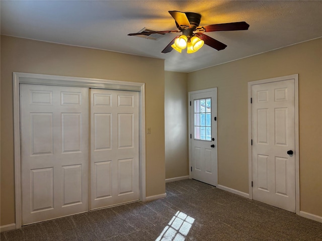 carpeted entrance foyer with ceiling fan