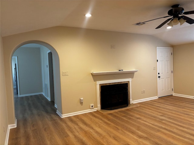 unfurnished living room with ceiling fan, lofted ceiling, and hardwood / wood-style floors