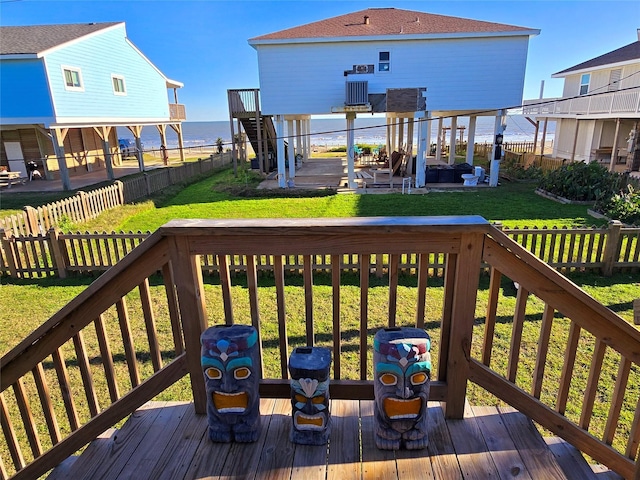 wooden terrace featuring a lawn