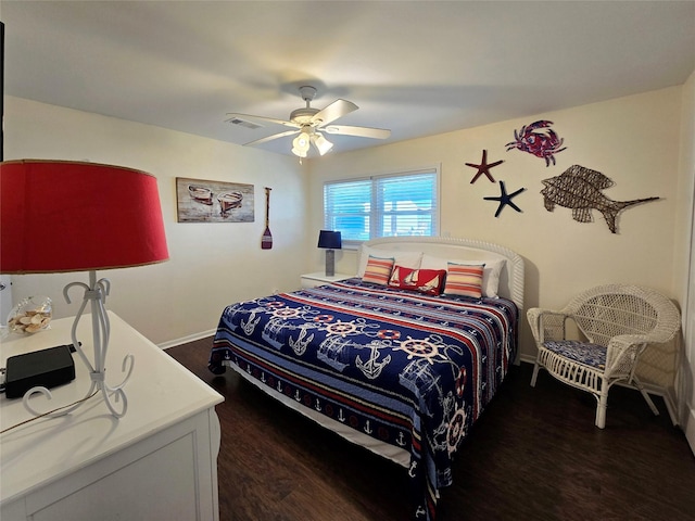 12929 John Reynolds Rd, Galveston, TX 77554 - bedroom with visible vents, a ceiling fan, baseboards, and dark wood-style flooring