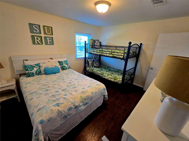 bedroom featuring dark wood-type flooring