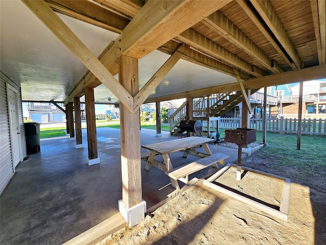 12929 John Reynolds Rd, Galveston, TX 77554 - view of patio / terrace featuring fence and stairs