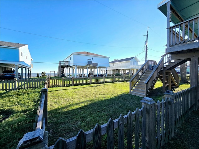 12929 John Reynolds Rd, Galveston, TX 77554 - view of yard with a fenced backyard and stairs