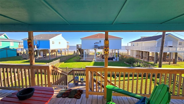 12929 John Reynolds Rd, Galveston, TX 77554 - wooden deck featuring a yard