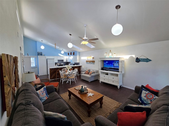 living room featuring dark hardwood / wood-style flooring, vaulted ceiling, and ceiling fan