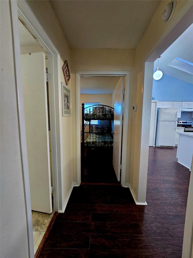 corridor featuring dark hardwood / wood-style floors