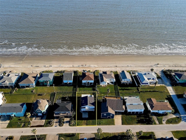 12929 John Reynolds Rd, Galveston, TX 77554 - drone / aerial view featuring a view of the beach, a water view, and a residential view