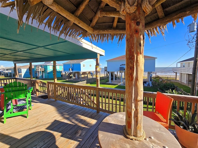 12929 John Reynolds Rd, Galveston, TX 77554 - wooden deck featuring a gazebo and a residential view