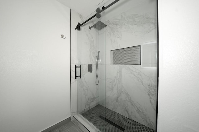 bathroom with a shower with shower door