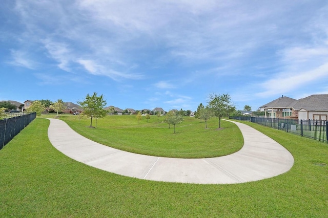 view of property's community featuring a yard