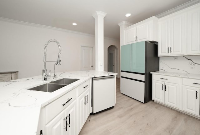 kitchen featuring dishwasher, refrigerator, sink, crown molding, and white cabinetry