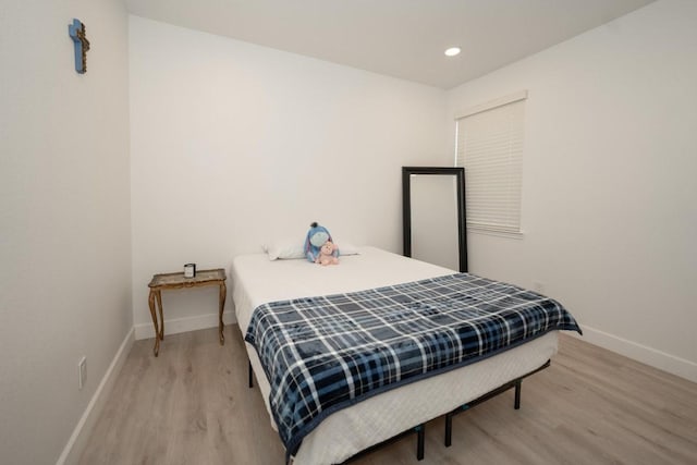 bedroom featuring wood-type flooring