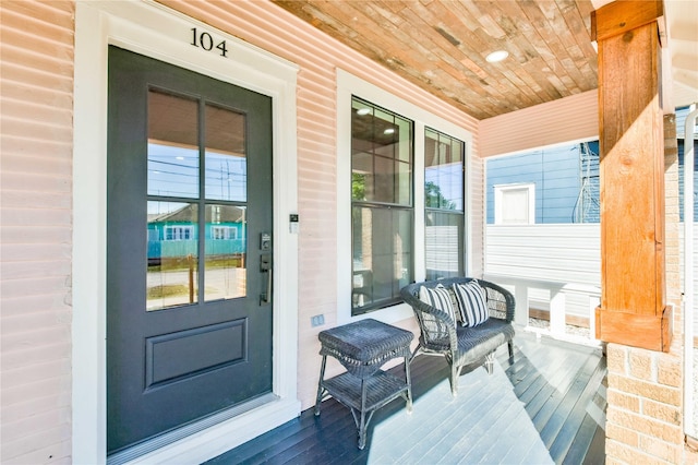 entrance to property featuring a porch