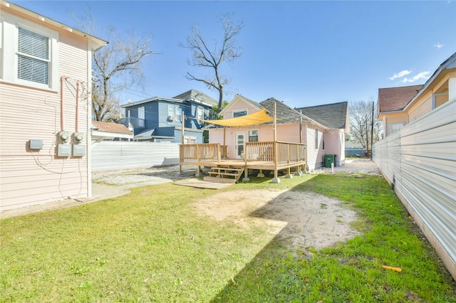 view of yard with a wooden deck