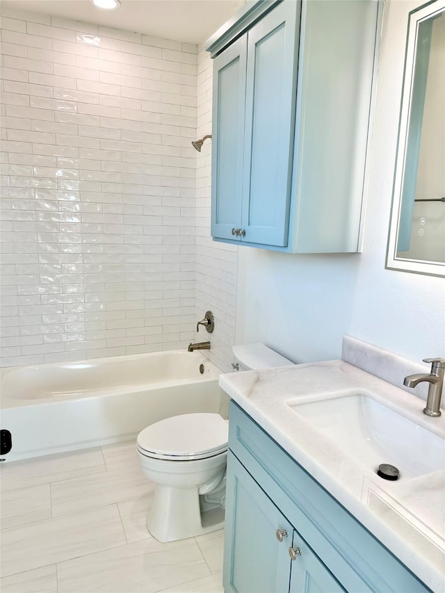 full bathroom featuring toilet, tile patterned flooring, tiled shower / bath combo, and vanity