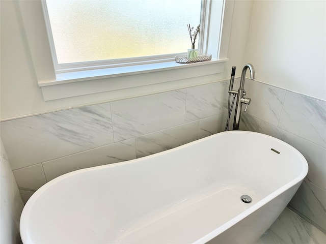 bathroom with a washtub