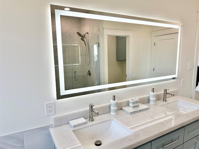 bathroom featuring walk in shower and vanity