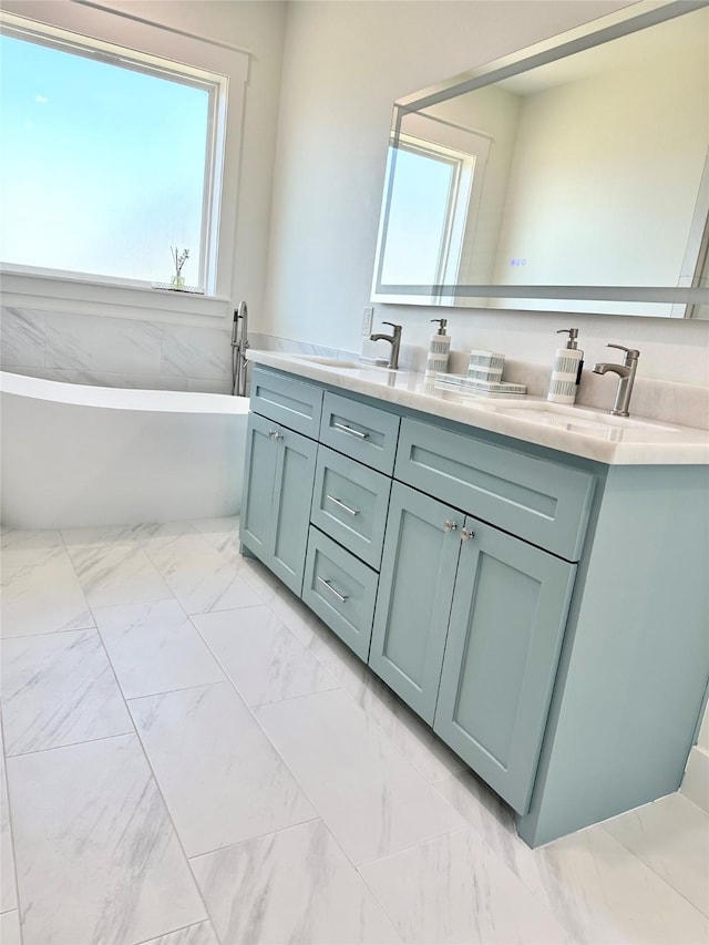 bathroom featuring vanity and a bathtub