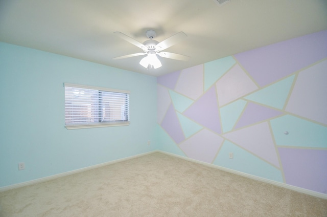 unfurnished room featuring light colored carpet and ceiling fan