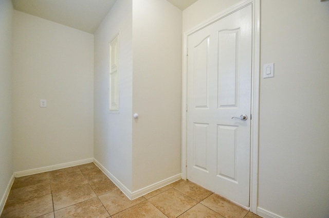 corridor with light tile patterned floors