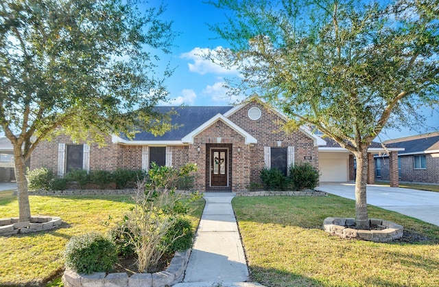 view of front of home with a garage and a front lawn